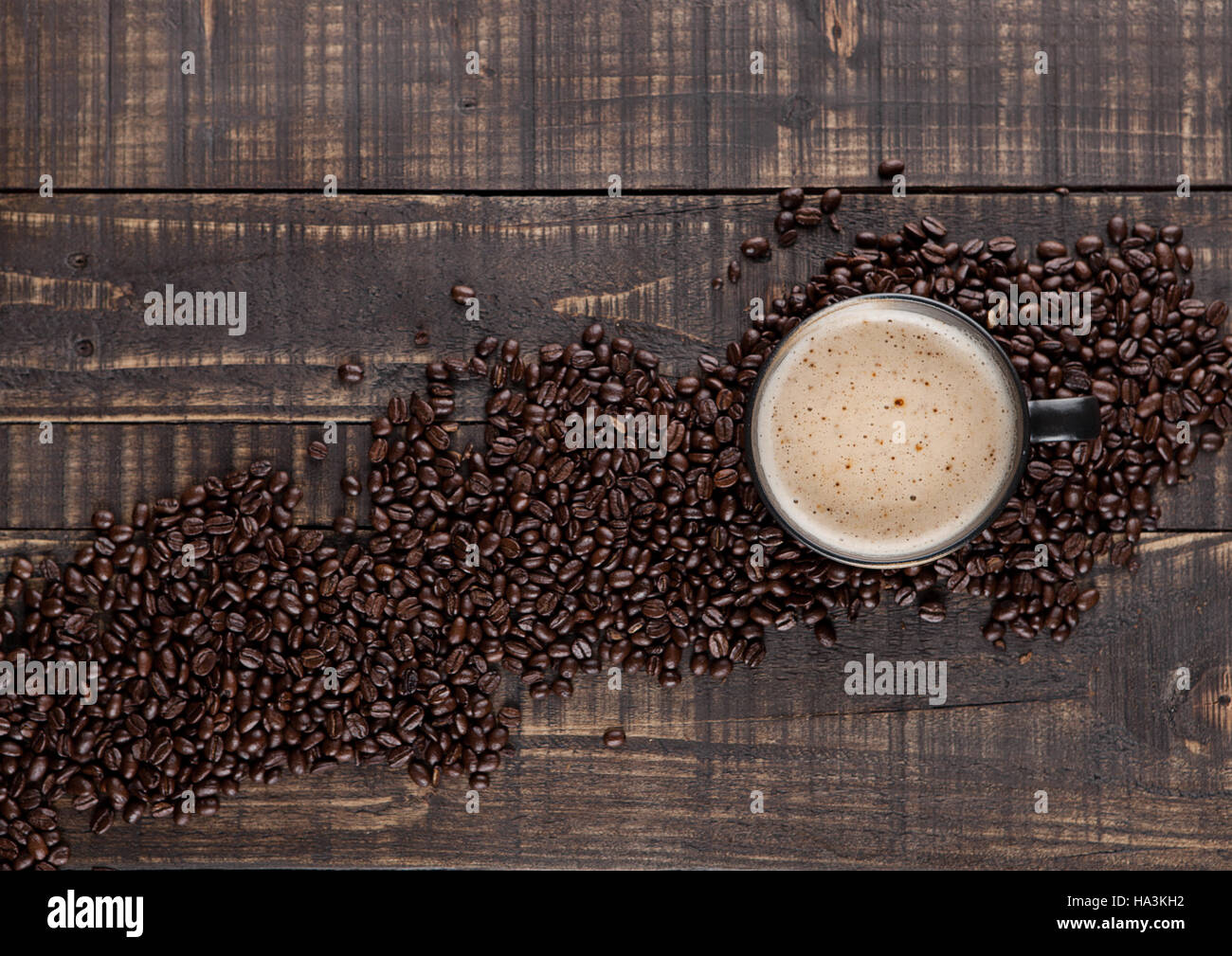 Large cup with hot cappuccino with coffee beans on wooden board Stock ...