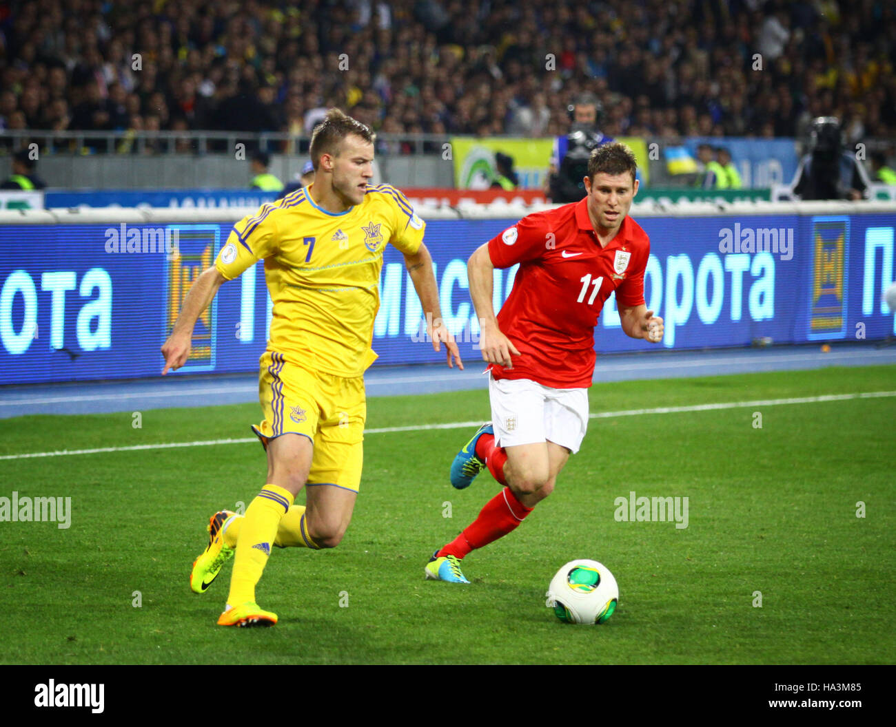 KYIV, UKRAINE - SEPTEMBER 10, 2013: Andriy Yarmolenko of Ukraine (L) fights for a ball with James Milner of England during their FIFA World Cup 2014 q Stock Photo