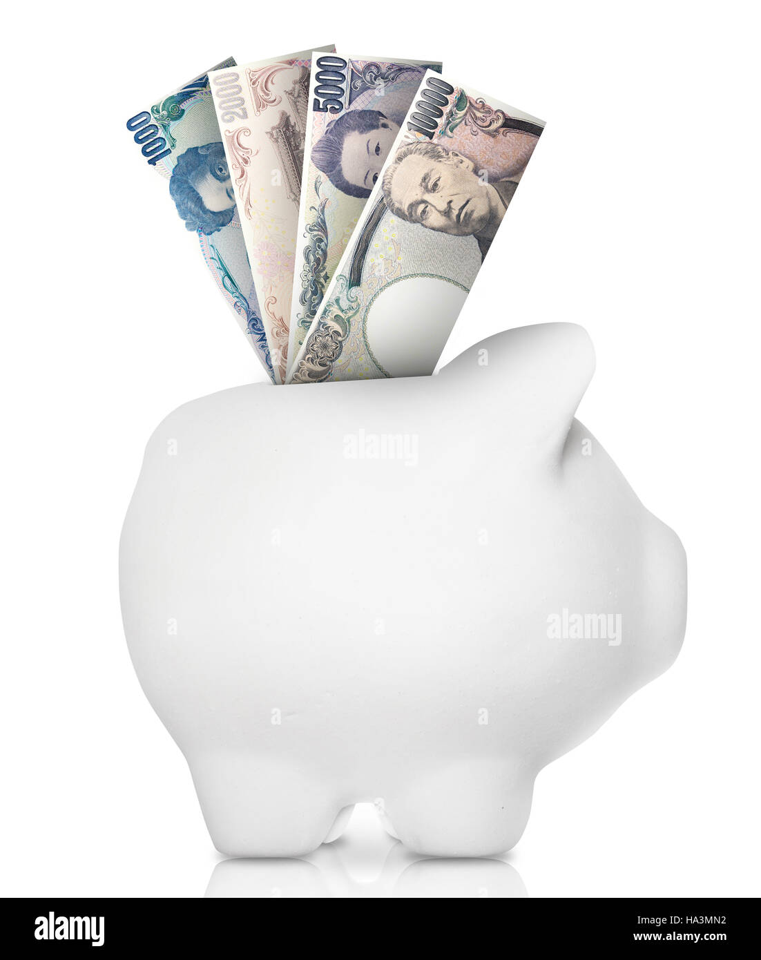 A white piggy bank filled with multiple bank notes. Stock Photo