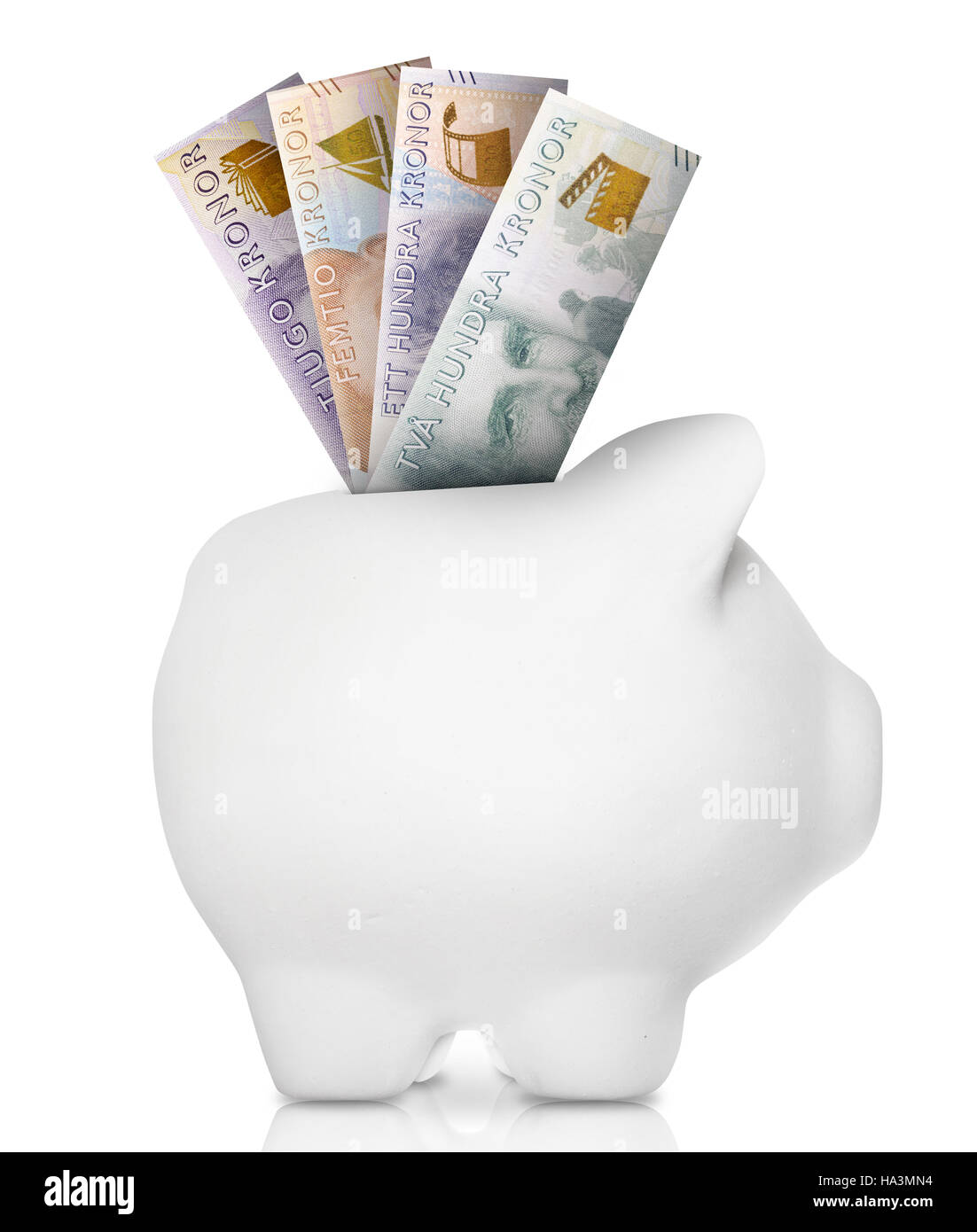 A white piggy bank filled with multiple bank notes Stock Photo Alamy
