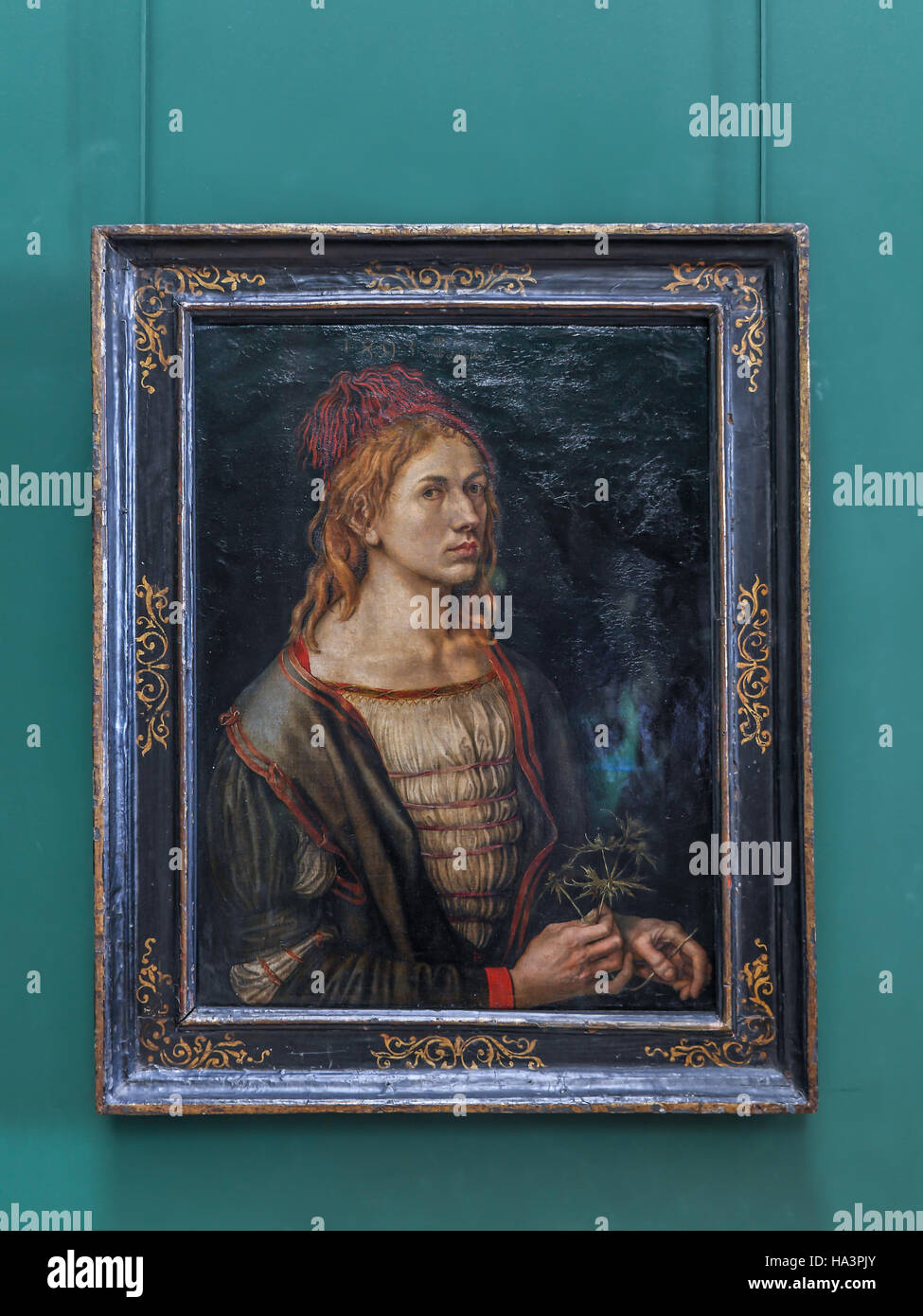 Self-Portrait or Portrait of the Artist Holding a Thistle - portrait painted by Dürer when he was 22- years old Stock Photo
