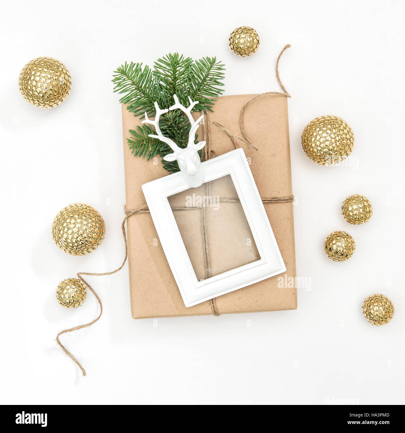 Christmas composition with wrapped gift and picture frame on white background Stock Photo