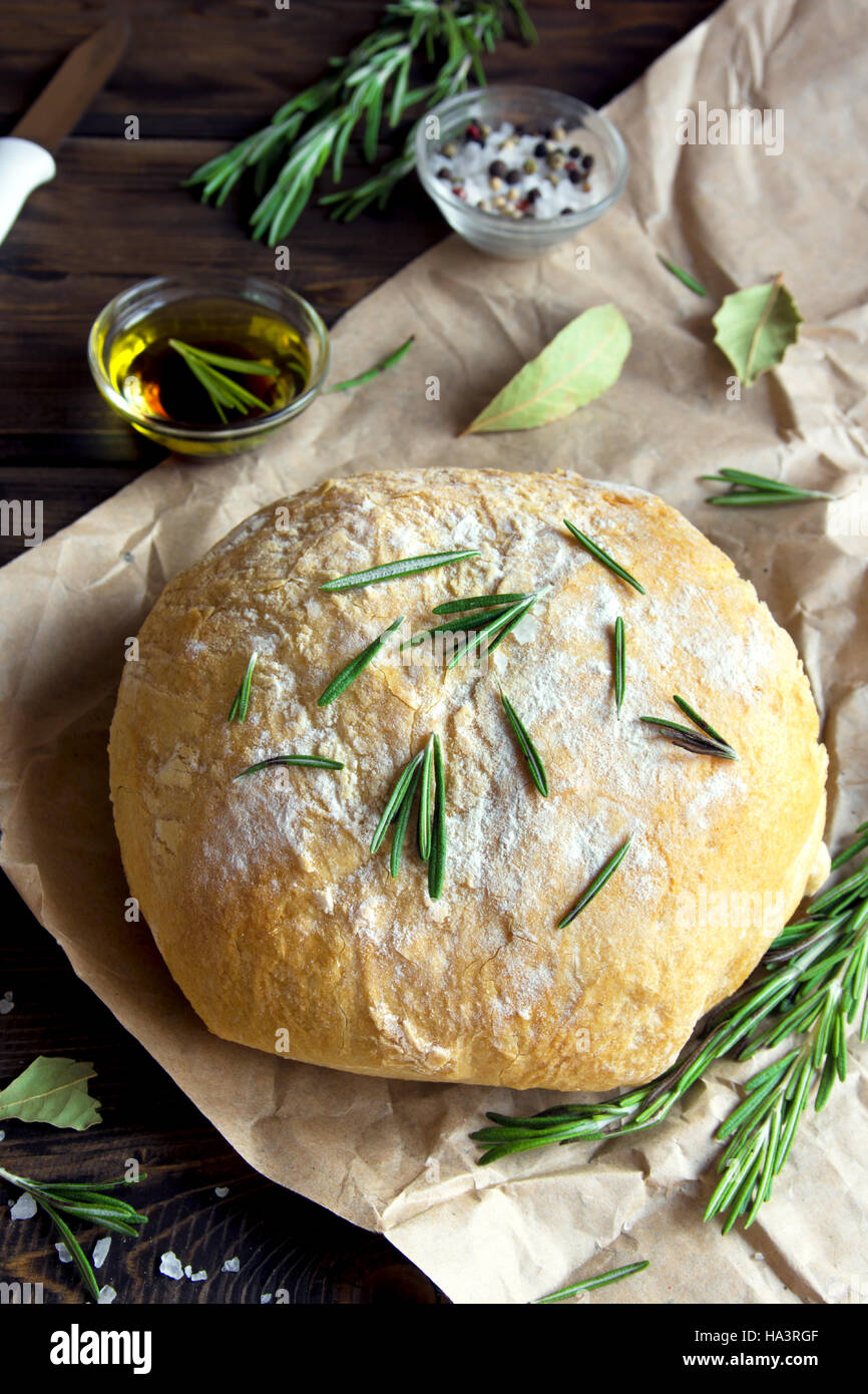 Fresh homemade ciabatta bread with rosemary and extra virgin olive oil