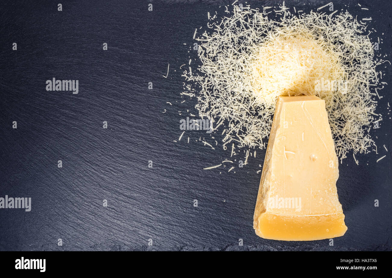 top down of single tasty fresh yellow big segment piece of parm and