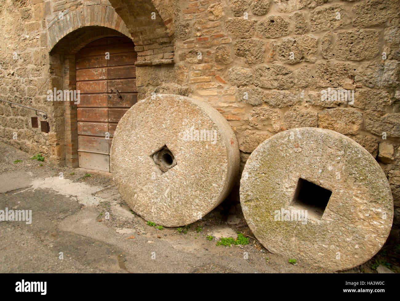 Couple of ancient millstones Stock Photo