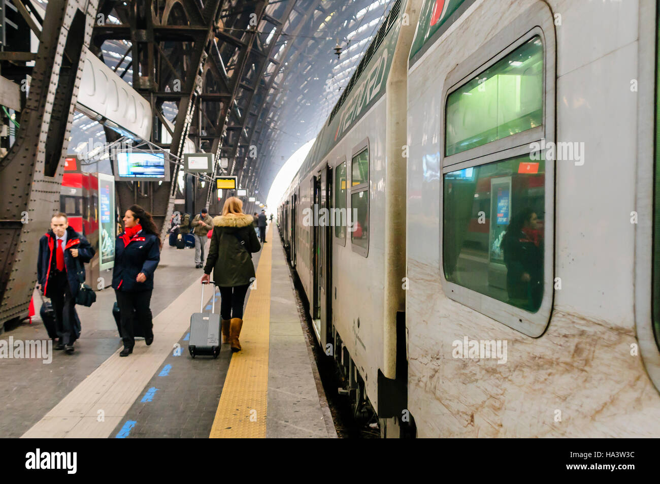 Passengers on the platform at Milan Railway Station, about to board a Trenitalia train. Stock Photo