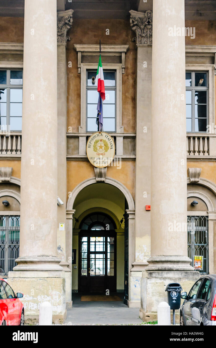 Italian flag above the entrance to the Liceo Ginnasio Classico Statale Paolo Sarpi high school, Citta Alta, Bergamo, Italy Stock Photo