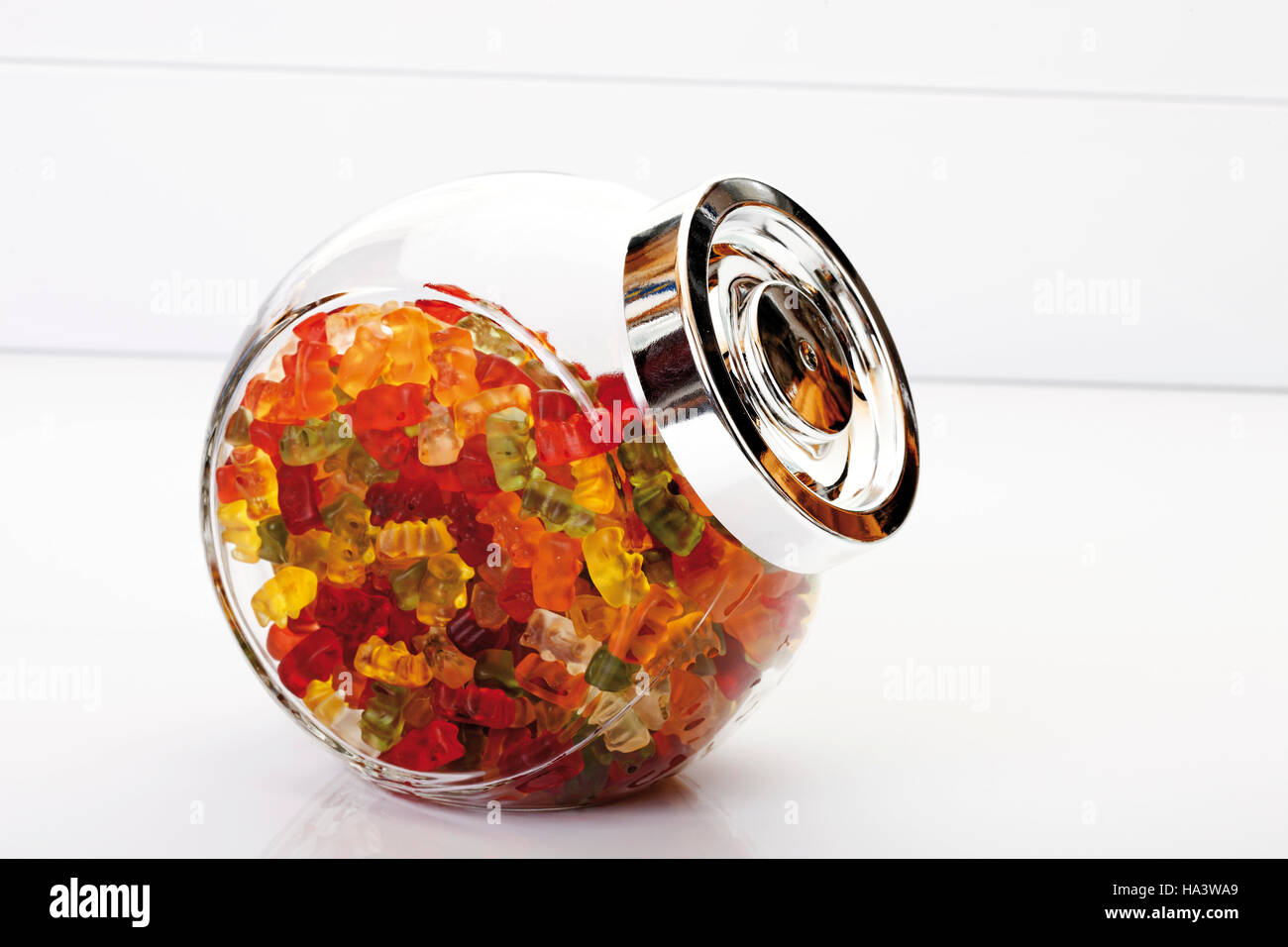 Multicoloured gummi bears in jar Stock Photo Alamy
