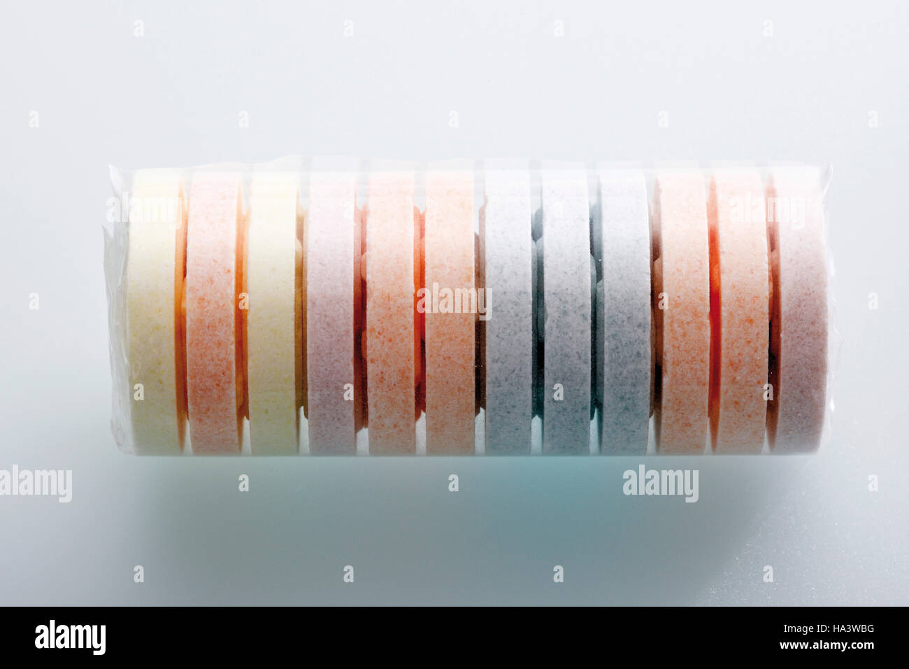 Roll of multicoloured grape sugars Stock Photo Alamy