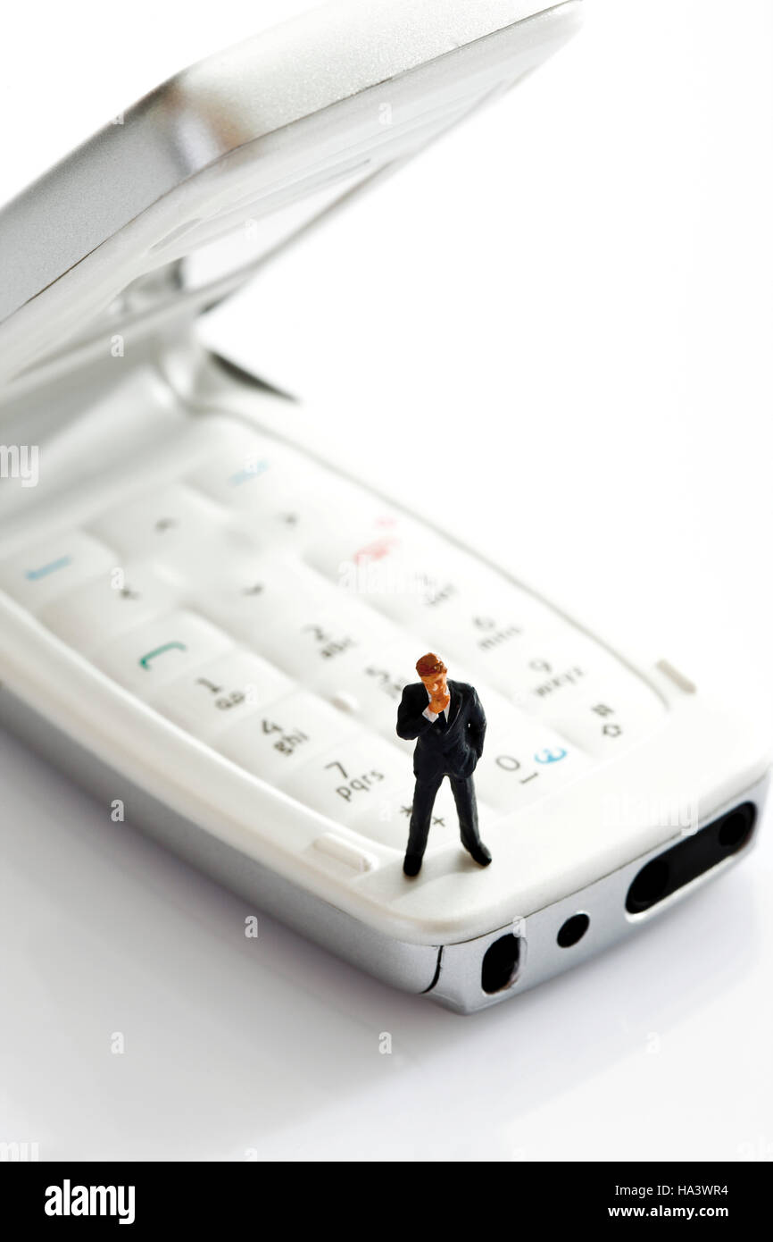 Manager figurine on opened mobile Stock Photo - Alamy