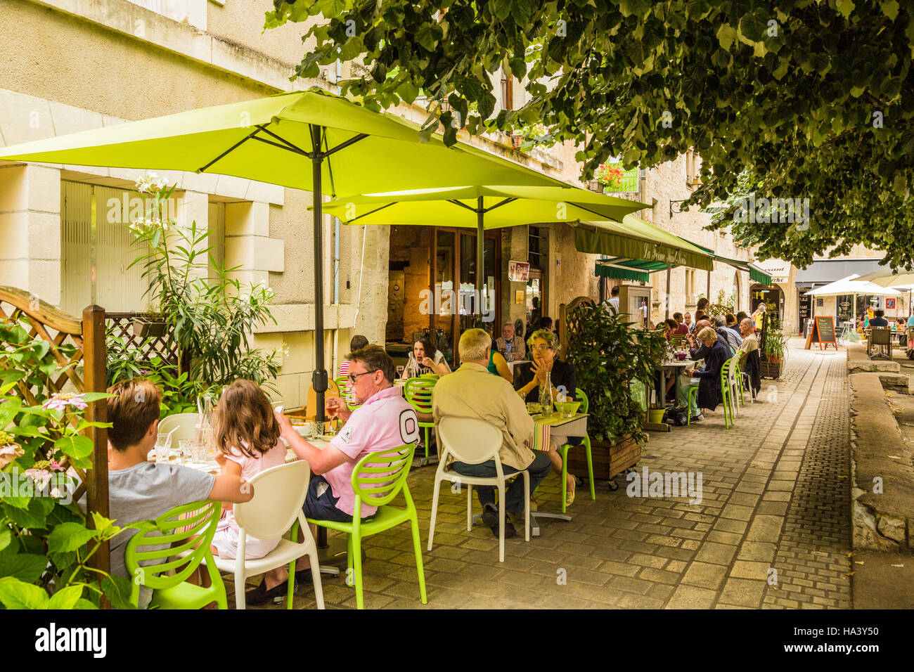 alfresco lunch at cafe in shaded square of Bergerac France Stock Photo