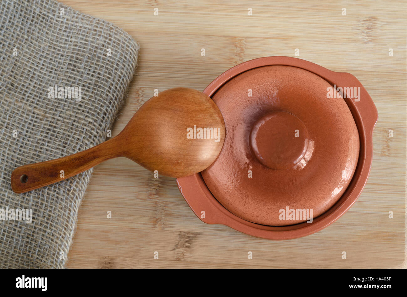 Ceramic pot and wooden spoon Stock Photo - Alamy