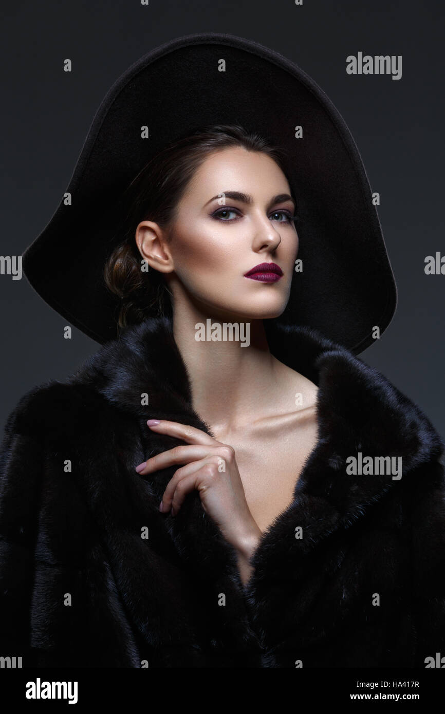 Beautiful girl in fur coat and hat Stock Photo Alamy