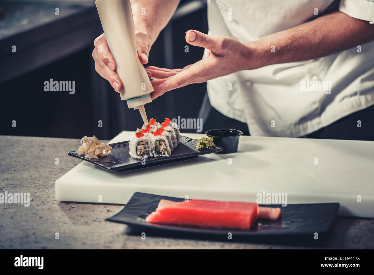 male cooks preparing sushi Stock Photo