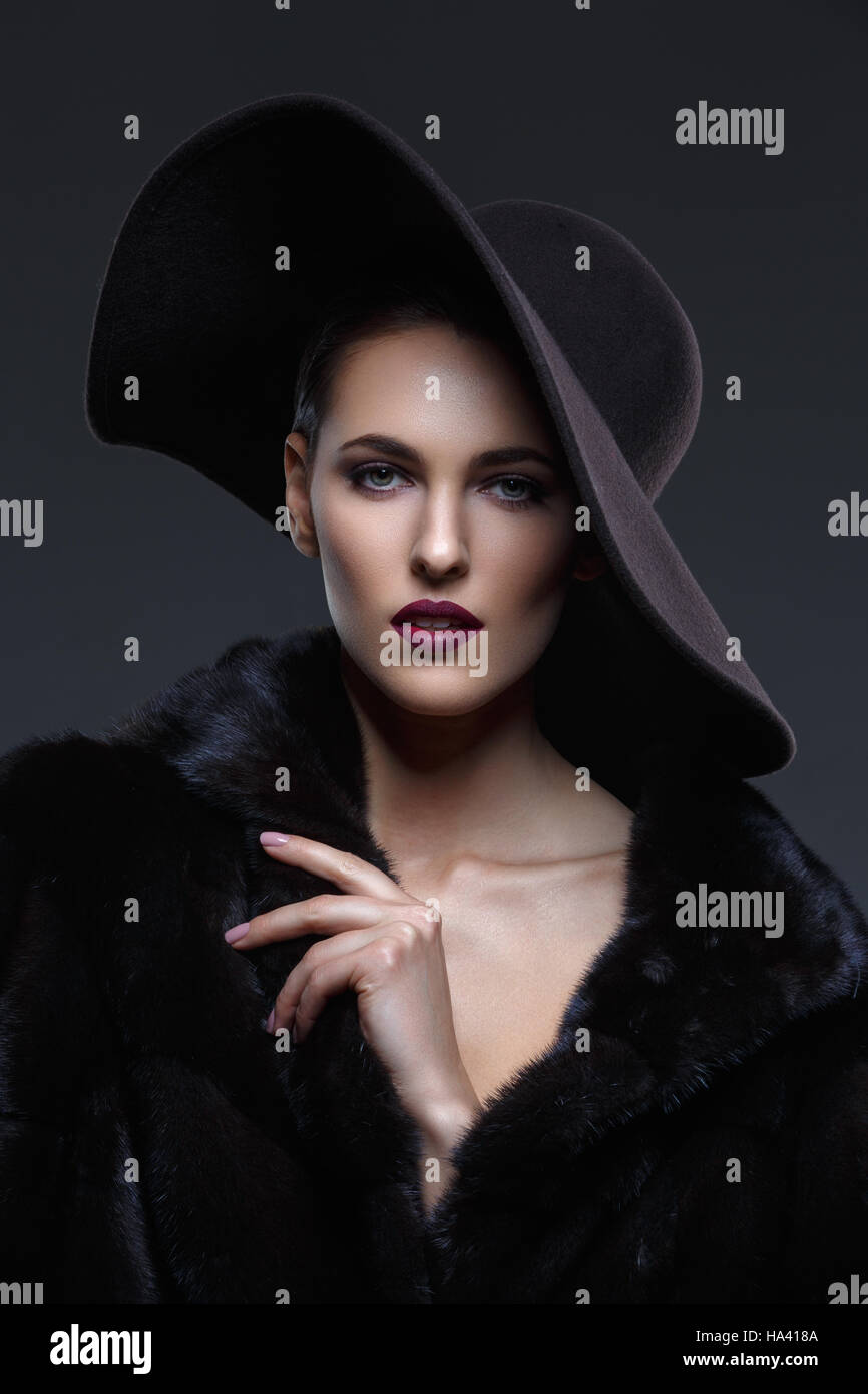 Beautiful girl in fur coat and hat Stock Photo - Alamy