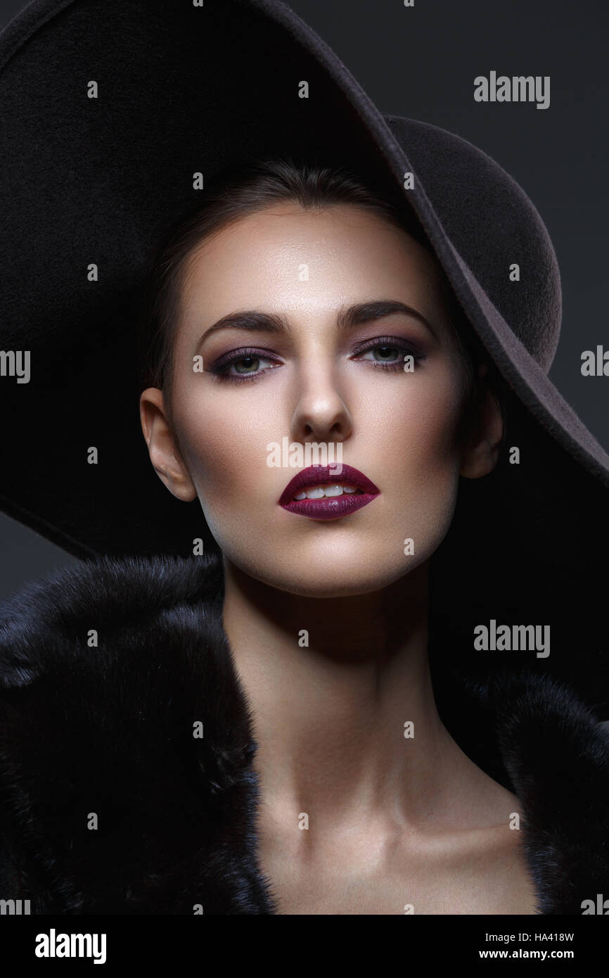 Beautiful girl in fur coat and hat Stock Photo - Alamy