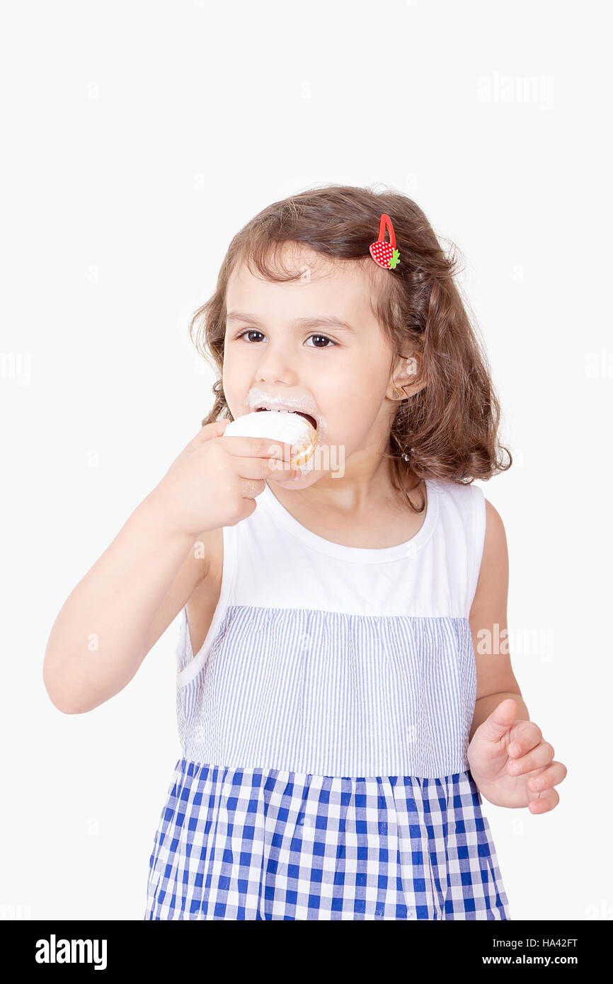 Happy girl eating kahk el Eid ( Feast Cookies Stock Photo 
