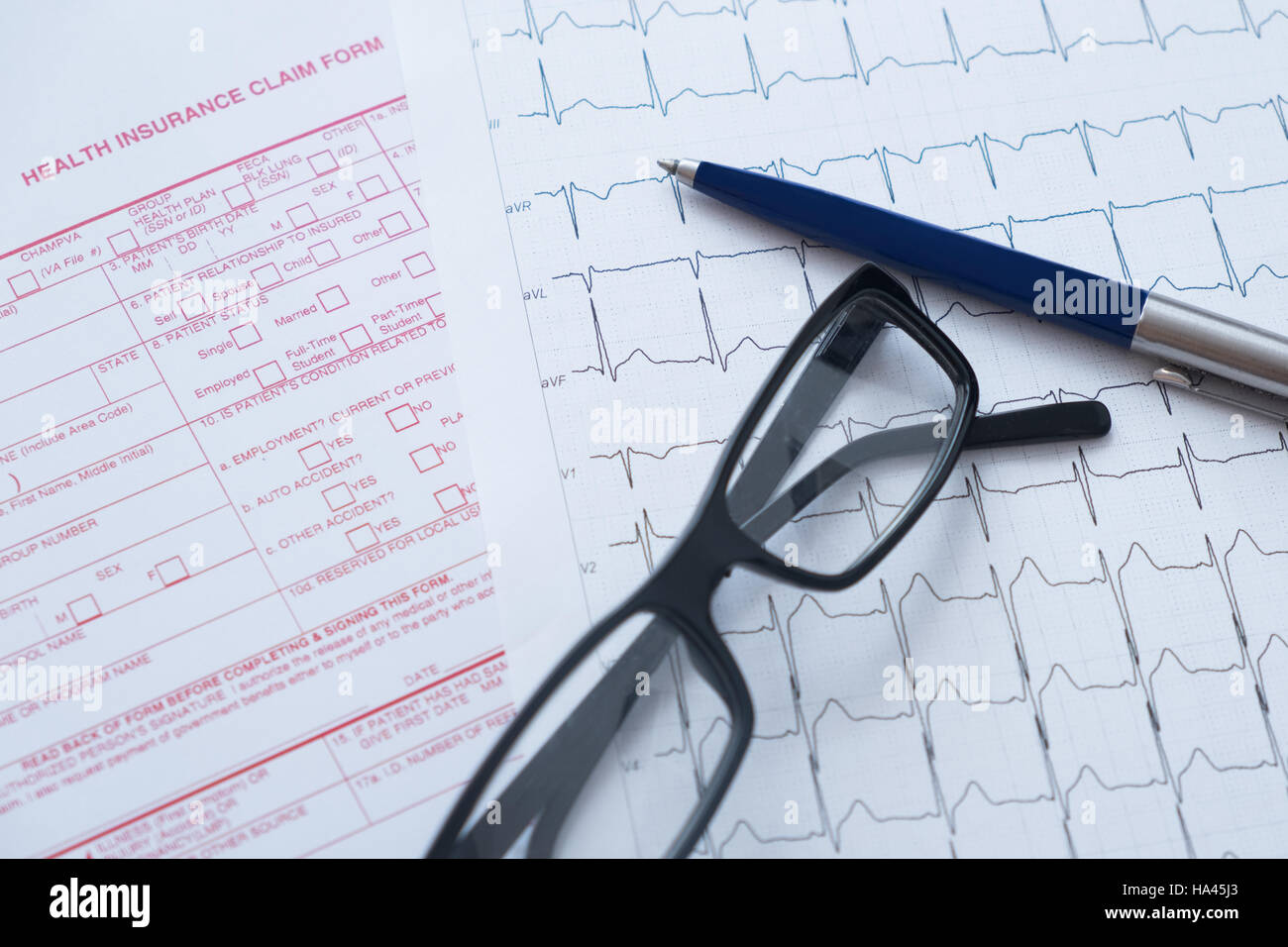 Health insurance claim form with pen and glasses Stock Photo Alamy