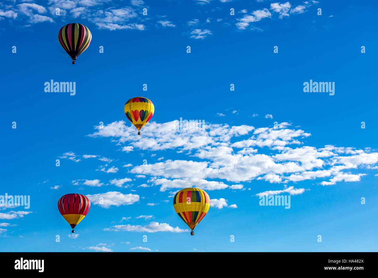 Hot Air Balloons fly over the city of Albuquerque, New Mexico during