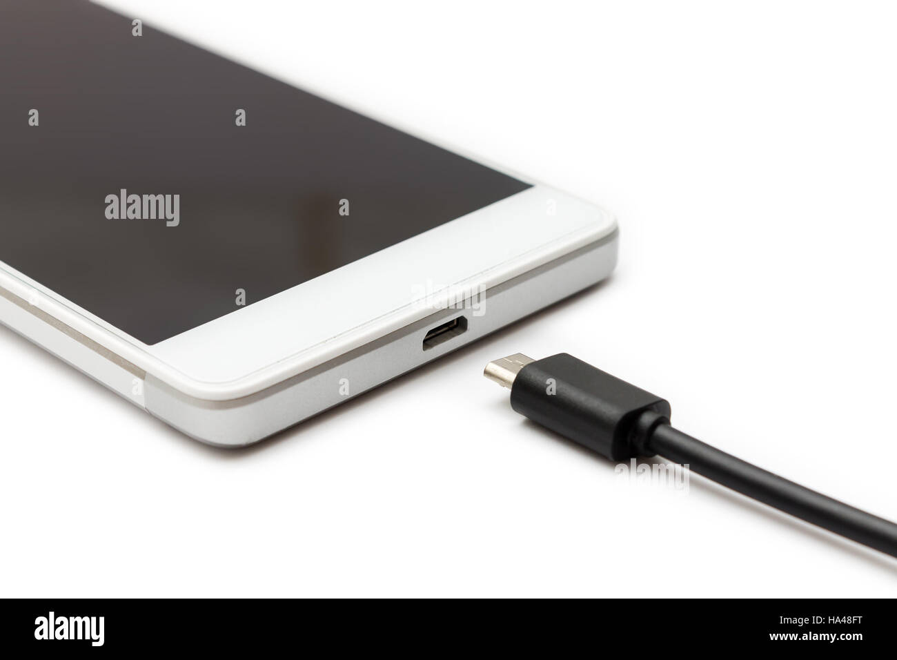 Micro USB data cable disconnected from the smartphone. White background