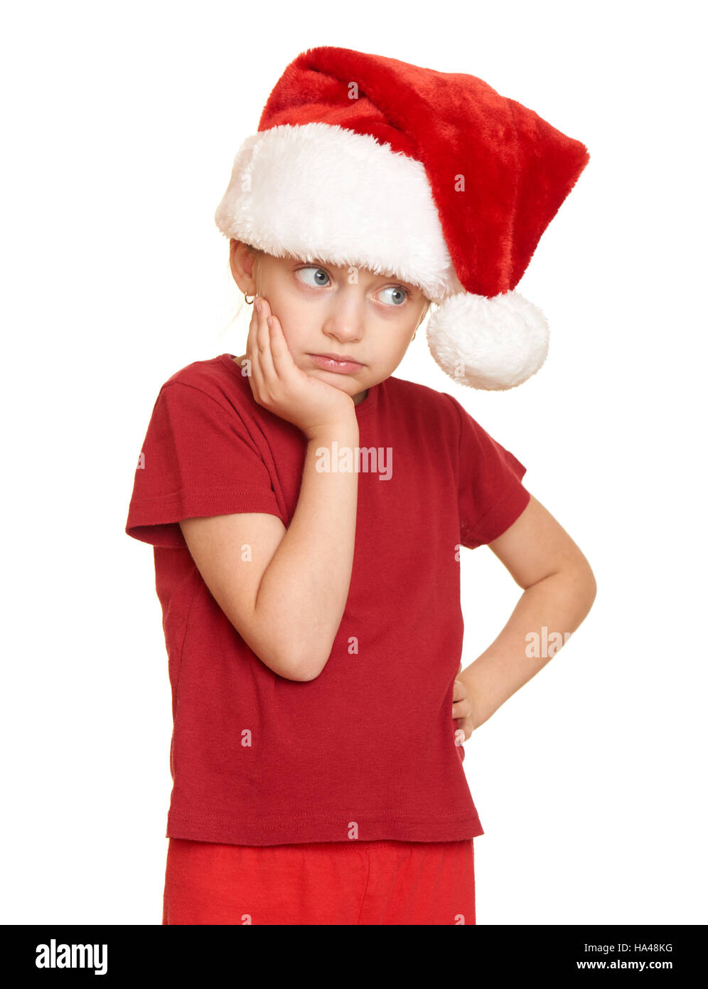 sad girl child in santa hat portrait on white isolated, christmas holiday concept Stock Photo