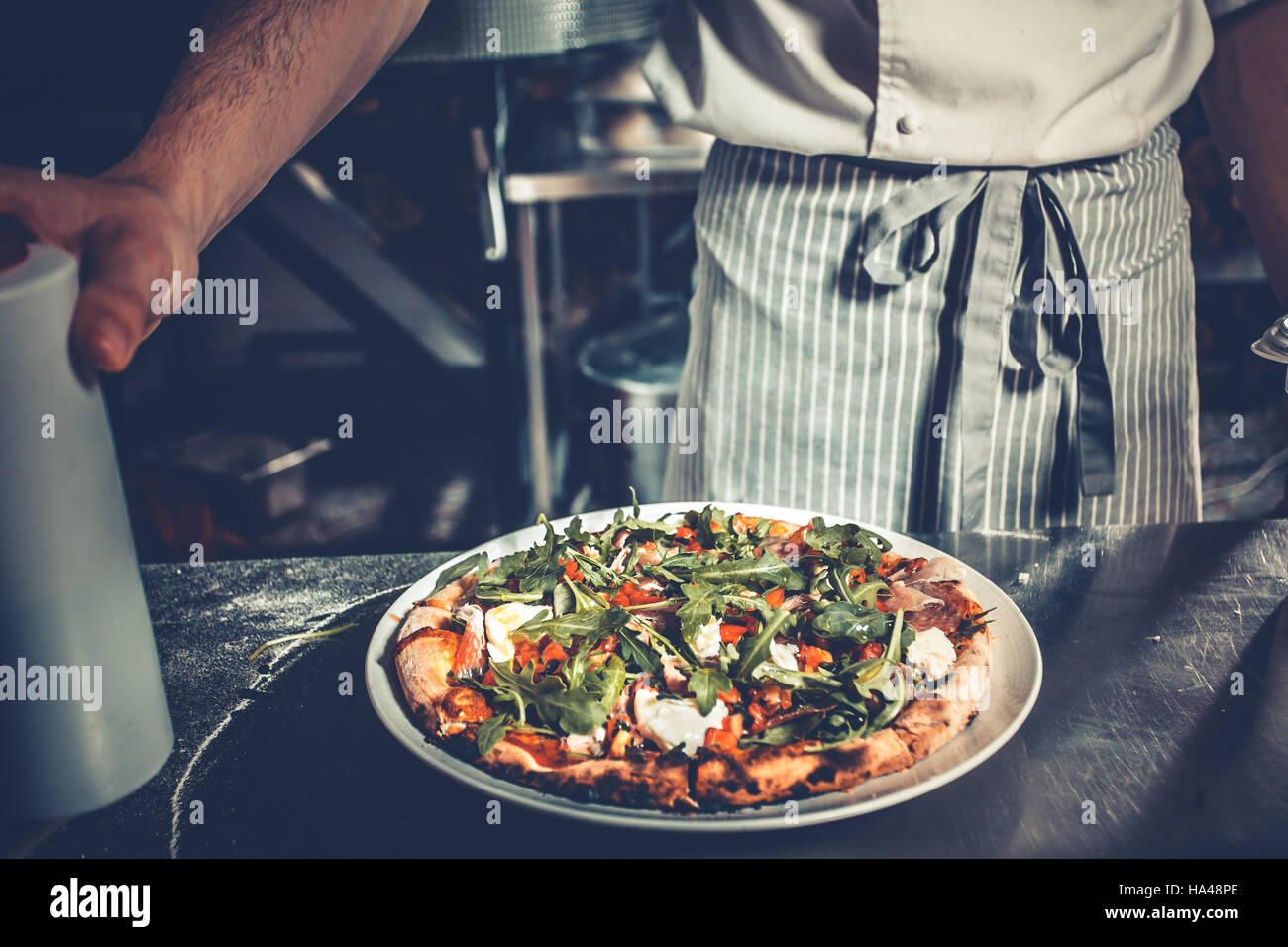 Chef cooking gourmet pizza Stock Photo