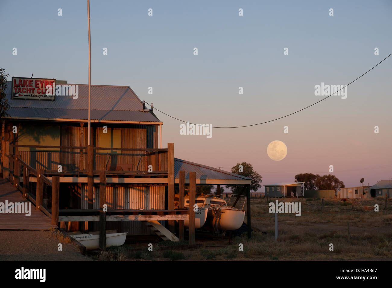 A super moon rises near the Lake Eyre Yacht Club at Marree in Outback Australia Stock Photo