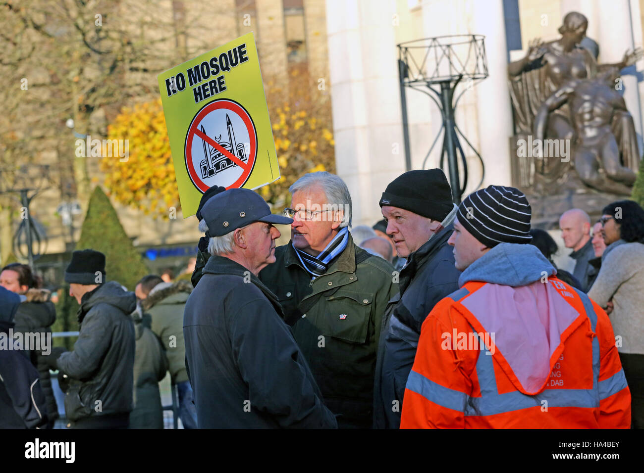 Bolton, Lancashire, UK. 26th November, 2016. British National Party member holding up a sign which reads 'No Mosque here', Bolton, Lancashire, UK. 26th Nov, 2016. Credit:  Barbara Cook/Alamy Live News Stock Photo