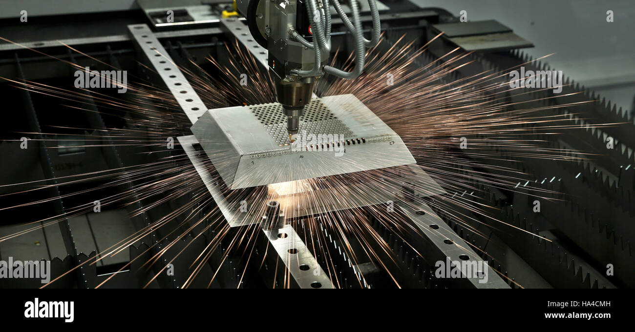 Limbach-Oberfrohna, Germany. 23rd Nov, 2016. A computer-controlled high-tech laser cutting device of the sheet metal processing company OMEGA Blechbearbeitung AG cuts up a steel part in Limbach-Oberfrohna, Germany, 23 November 2016. Seven companies from the manufacturing network in the western part of the German state Saxony have set up their own glass fibre network. Photo: Jan Woitas/dpa-Zentralbild/dpa/Alamy Live News Stock Photo