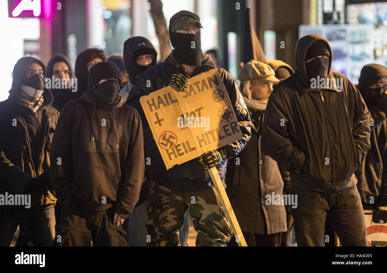 Montreal, Quebec, Canada. 26th November, 2016. Demonstrators outside the Theatre Plaza as they protest against a concert by Polish black metal rock band Graveland. Protesters labelling themselves 'anti-fascists militants' were protesting what they call a racist band. Dario Ayala/Alamy Live News Stock Photo