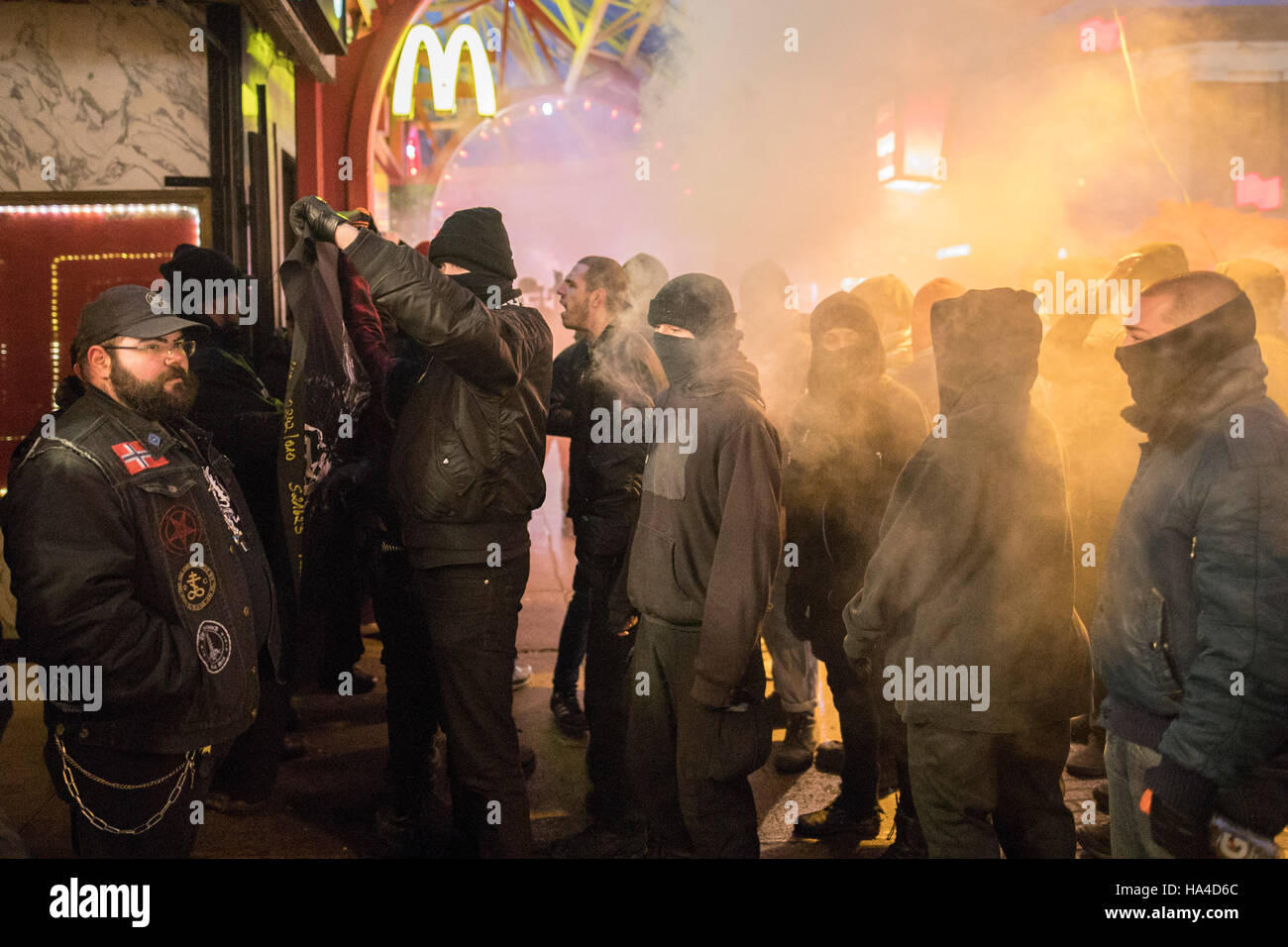 Montreal, Quebec, Canada. 26th November, 2016. Demonstrators clash with security outside the Theatre Plaza as they protest against a concert by Polish black metal rock band Graveland. Protesters labelling themselves 'anti-fascists militants' were protesting what they call a racist band. Dario Ayala/Alamy Live News Stock Photo