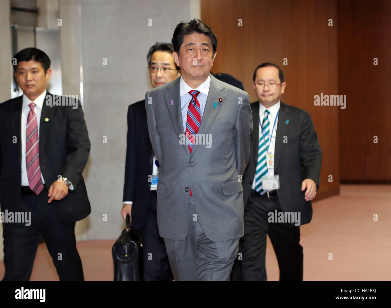 Tokyo, Japan. 25th Nov, 2016. Japanese Prime Minister Shinzo Abe arrives at the Health, Labour and Welfarre committee session of the Lower House at the National Diet in Tokyo on Friday, November 25, 2016. Ruling coalition parties passed the government's pension reform bill at the committee session while opposition parties' members protest against the forced passage of the bill. © Yoshio Tsunoda/AFLO/Alamy Live News Stock Photo