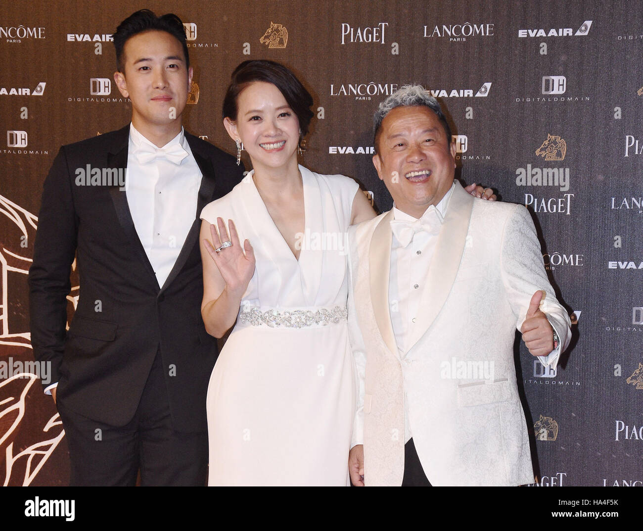Taipei. 27th Nov, 2016. (R-L) Eric Tsang, Bowie Tsang and Derek Tsang arrive for the awarding ceremony of the 53rd Golden Horse Awards in Taipei, southeast China's Taiwan, Nov. 26, 2016. The event was held here on Saturday. © Xinhua/Alamy Live News Stock Photo