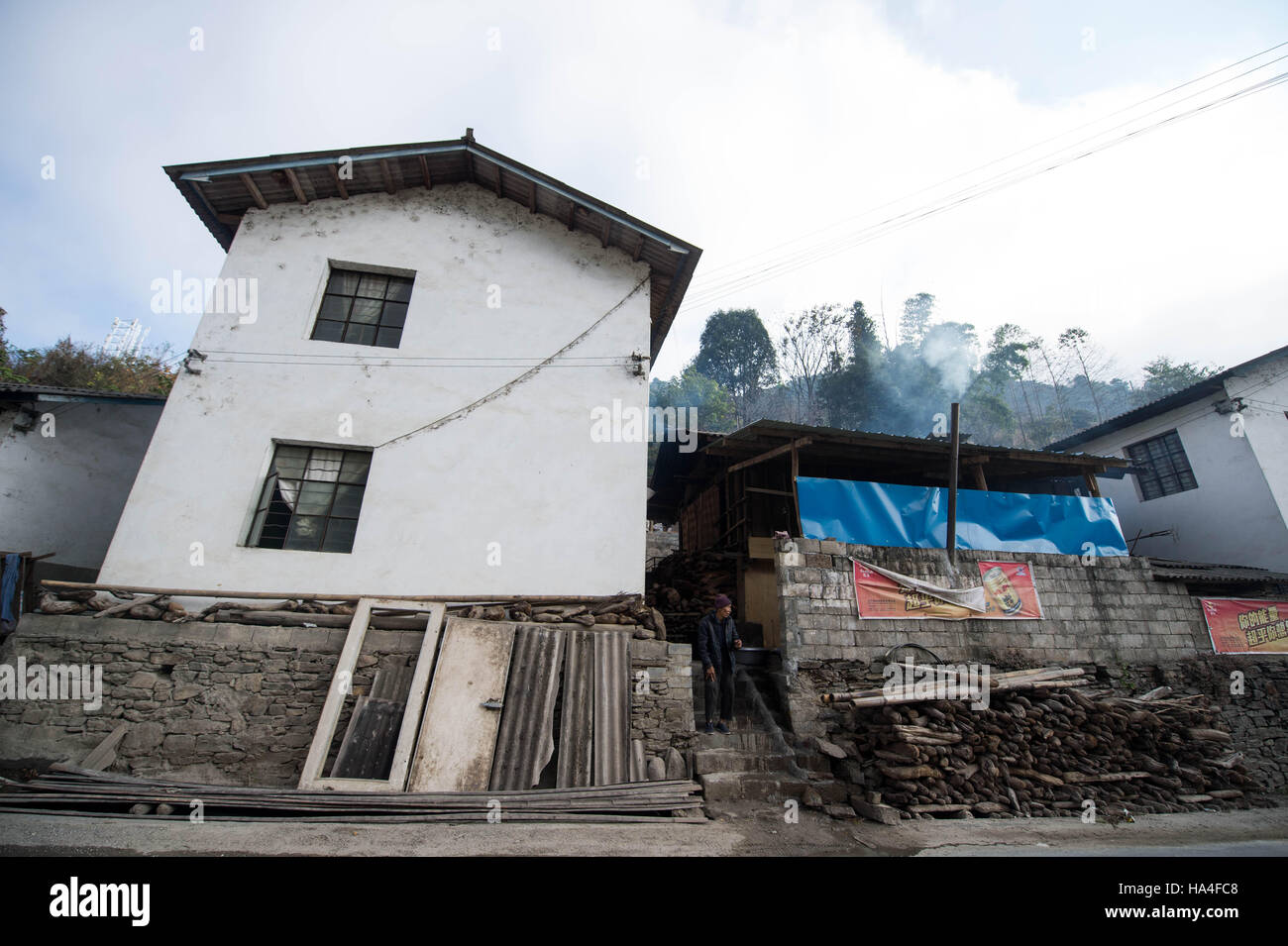 Nujiang. 27th Nov, 2016. Photo taken on Nov. 25 shows the house where 102-year-old Niqianha lives at Lazhudi Village of Shangpa Town in Lisu Autonomous Prefecture of Nujiang, southwest China's Yunnan Province. Born in 1914, Niqianha attributes her longevity to a healthy lifestyle and diet as well as being happy and content with life. © Yin Gang/Xinhua/Alamy Live News Stock Photo