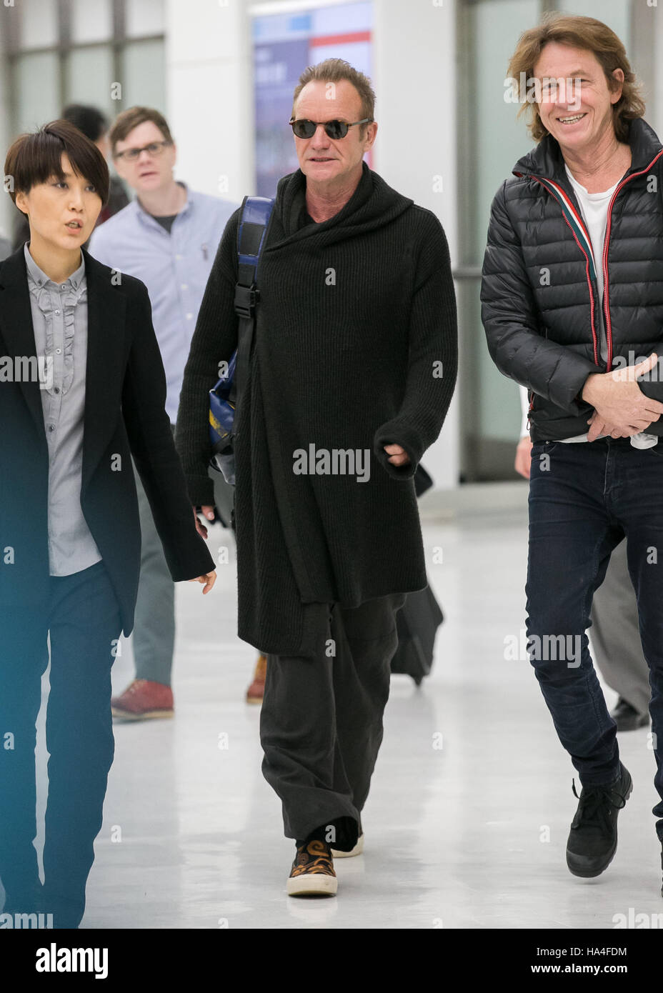 Chiba, Japan. 27th November, 2016. British singer-songwriter Sting (Gordon Matthew Thomas Sumner) (C) arrives at Narita International Airport in Chiba, Japan on November 27, 2016. Sting is in Japan to promote his twelfth solo studio album 57th & 9th. Credit:  AFLO/Alamy Live News Stock Photo