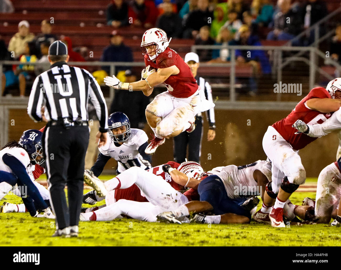 Palo Alto, California, USA. 26th Nov, 2016. Stanford Running Back Christian McCaffrey (5) leaps over the Rice defense in NCAA football action at Stanford University, featuring the Rice Owls visiting the Stanford Cardinal. Stanford won the game 41-17. © Seth Riskin/ZUMA Wire/Alamy Live News Stock Photo