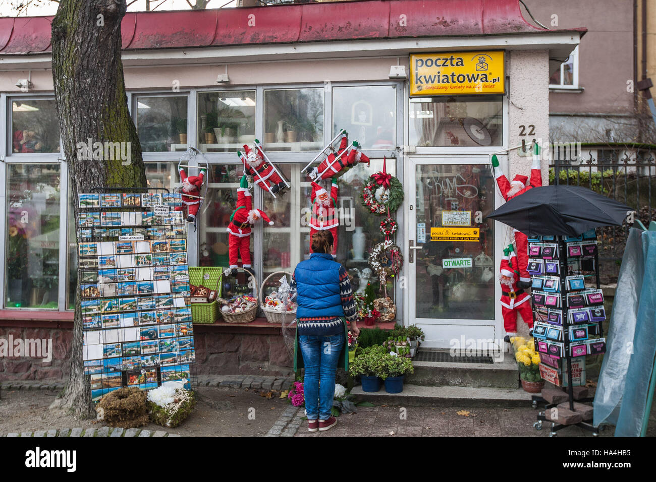 Sopot, Poland 27 November 2016 Cold day in Sopot. Lady standing outside the shop decorated on Christmas season is seen Meteorologists predict high snow fall in next few hours. Credit:  Michal Fludra/Alamy Live News Stock Photo
