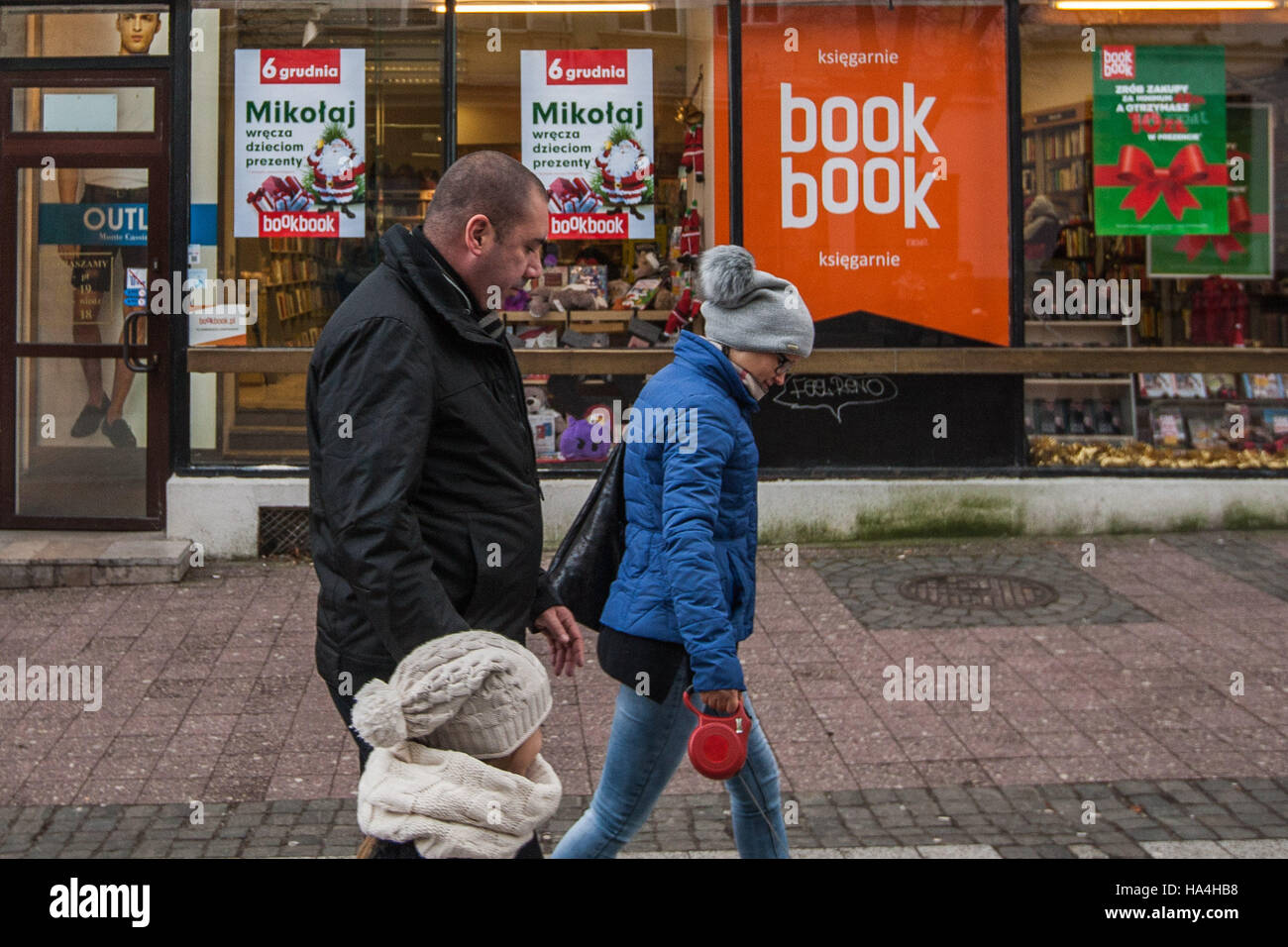Sopot, Poland 27 November 2016 Cold day in Sopot. People walking in winter clothes in front of Book Book bookstore decorated on Christmas seazon are seen. Meteorologists predict high snow fall in nex few hours. Credit:  Michal Fludra/Alamy Live News Stock Photo