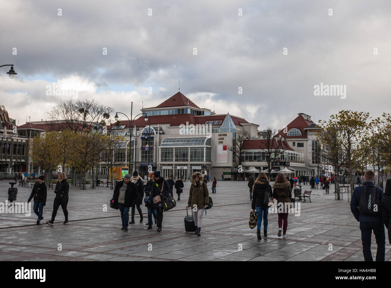 Sopot, Poland 27 November 2016 Cold day in Sopot. People walking in winter clothes at the Plac Zdrojowy are seen. Meteorologists predict high snow fall in nex few hours. Credit:  Michal Fludra/Alamy Live News Stock Photo