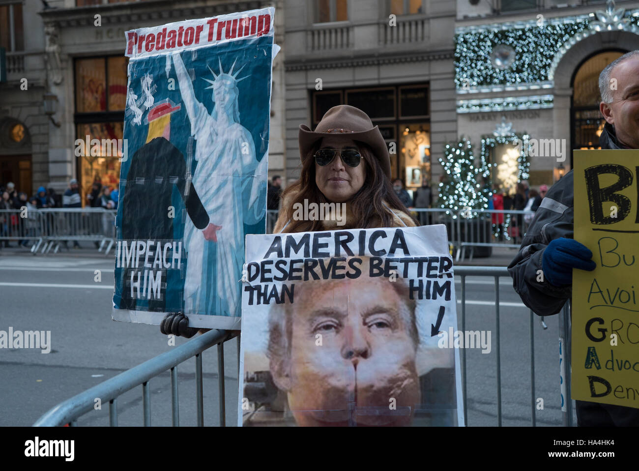 New York City, USA. 26th November, 2016. After the election Trump Tower, a Site that draws Tourists, Under Heavy Security. Blockade around Trump Tower is new normal for New Yorkers. Inside - the restaurants and shops of souvenirs with the symbols of the elected president. Tourists queuing. Activists continue to protest outside the blockade. Credit:  Andrey Borodulin/Alamy Live News Stock Photo