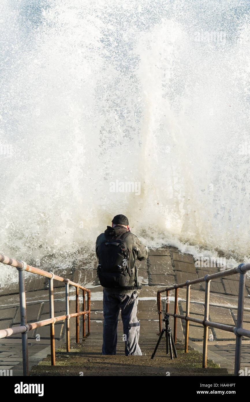 Aberdeen, Scotland, UK - 27 November 2016: UK weather - a photographer captures a backlit wave at high tide on a bright morning in Aberdeen Credit:  Kay Roxby/Alamy Live News Stock Photo