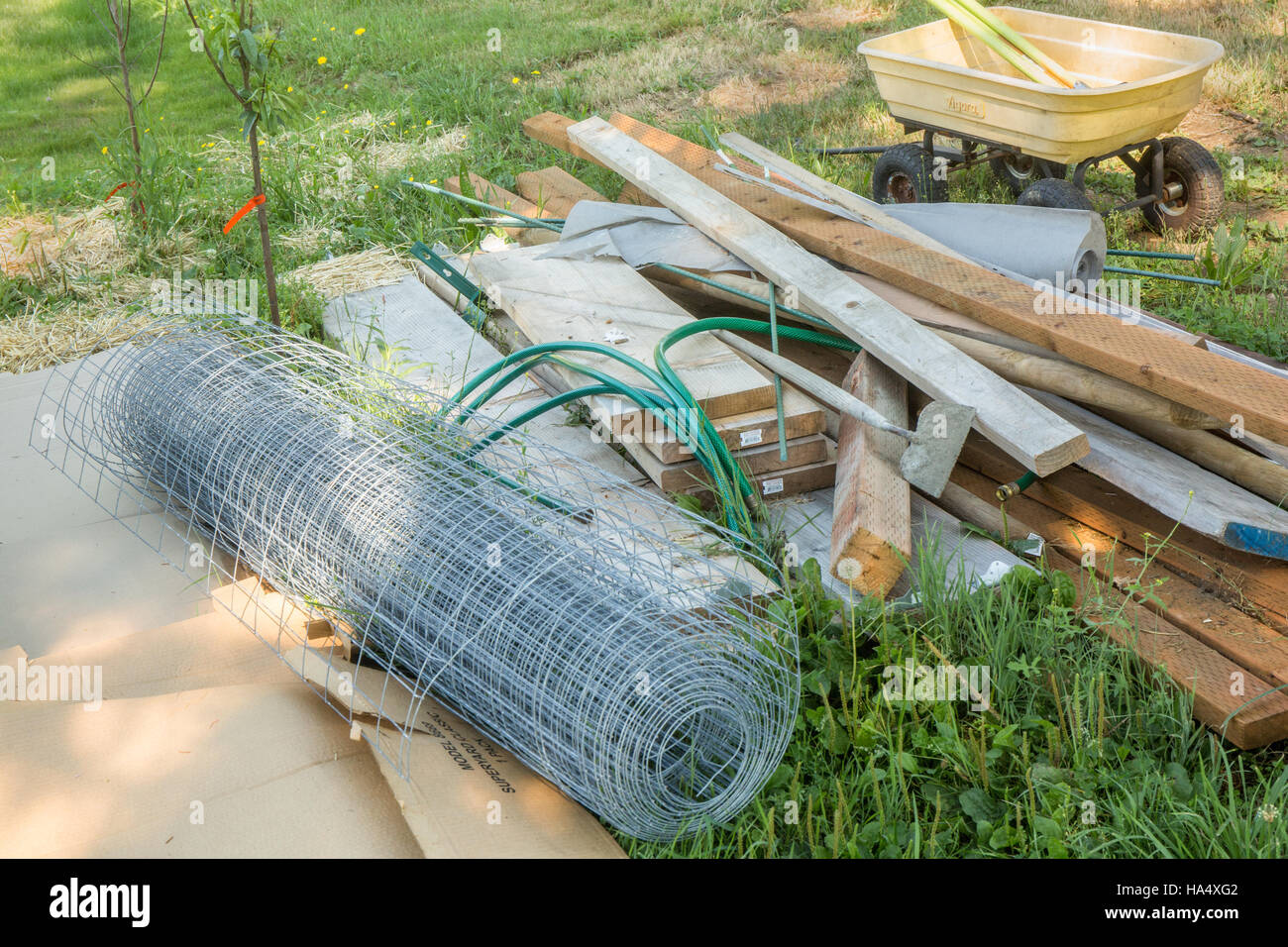 Fence building materials to fence in a garden in Maple Valley, Washington, USA Stock Photo