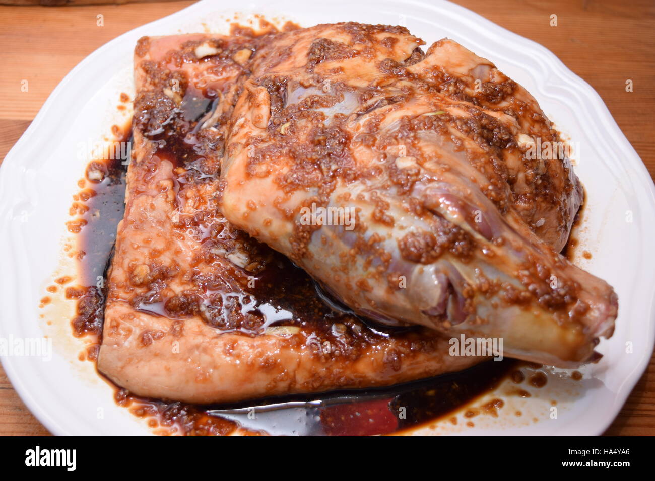 Organic lamb shoulder marinating Stock Photo - Alamy
