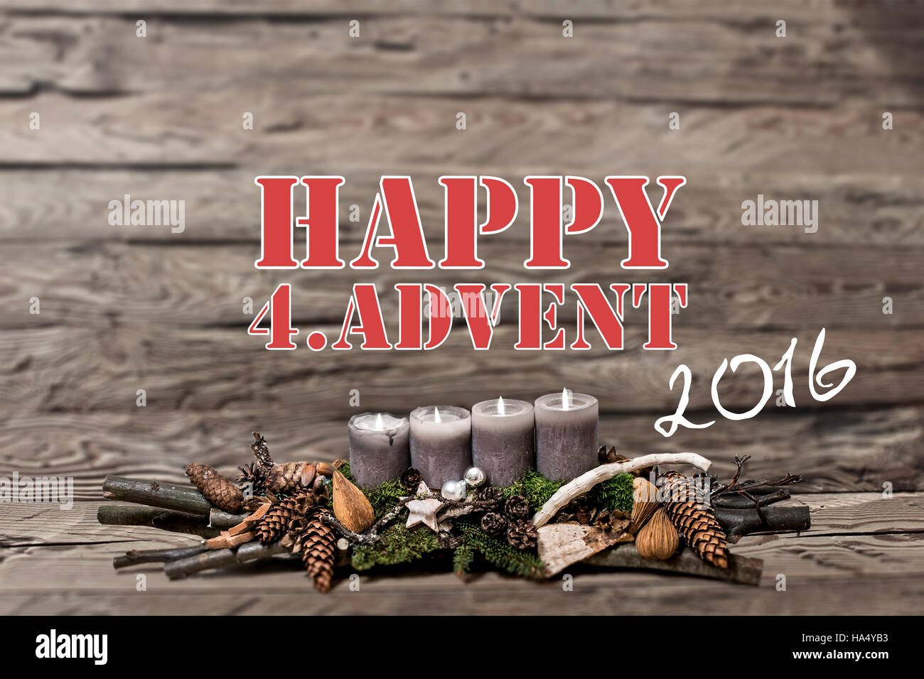 Merry Christmas decoration advent 2016 with burning grey candle Blurred background text message englisch 4th Stock Photo