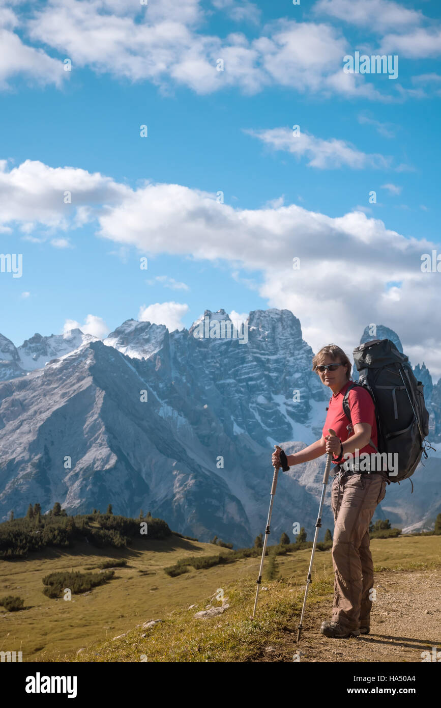 hiker in front of Alps mountains Stock Photo - Alamy