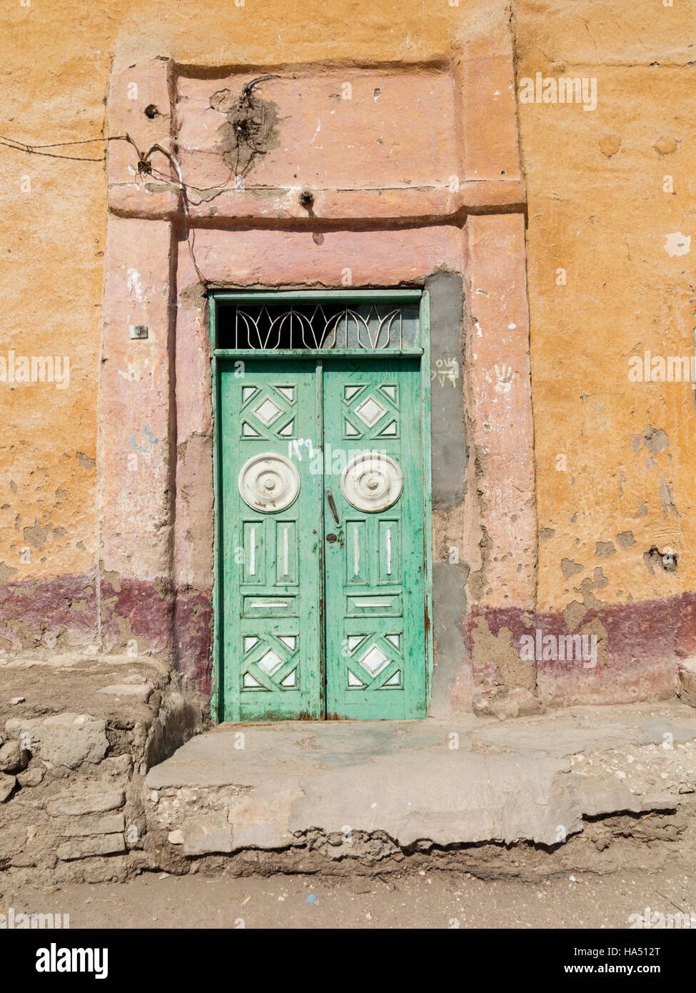 Ornate metal front door on one of  remaining old houses at Qurnet Murai on the West Bank of the River Nile at Luxor, Upper Egypt Stock Photo