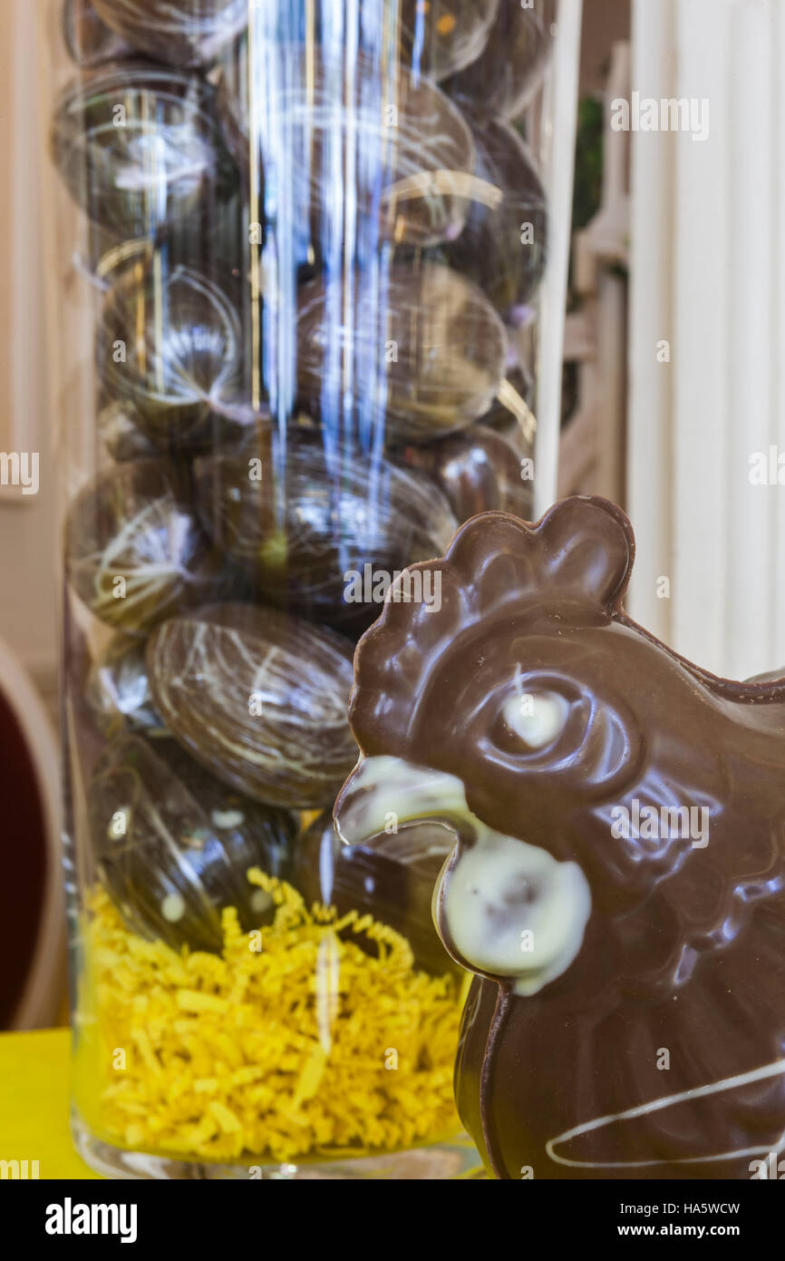 A hen in chocolate in a shop in France. The more traditional eggs can