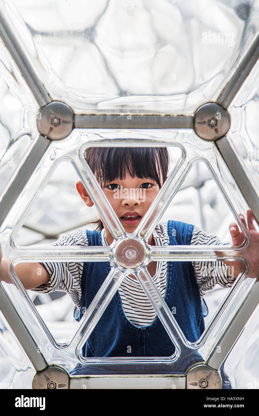 Unidentified boy at Hakone open air museum in Japan. Museum featuring over a thousand sculptures and works of art. Stock Photo