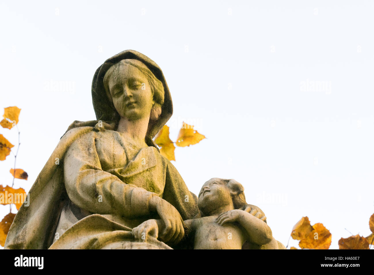 A stone statue of Madonna and Child outside the entrance to the Church of Our Lady, Bruges, Belgium. Stock Photo