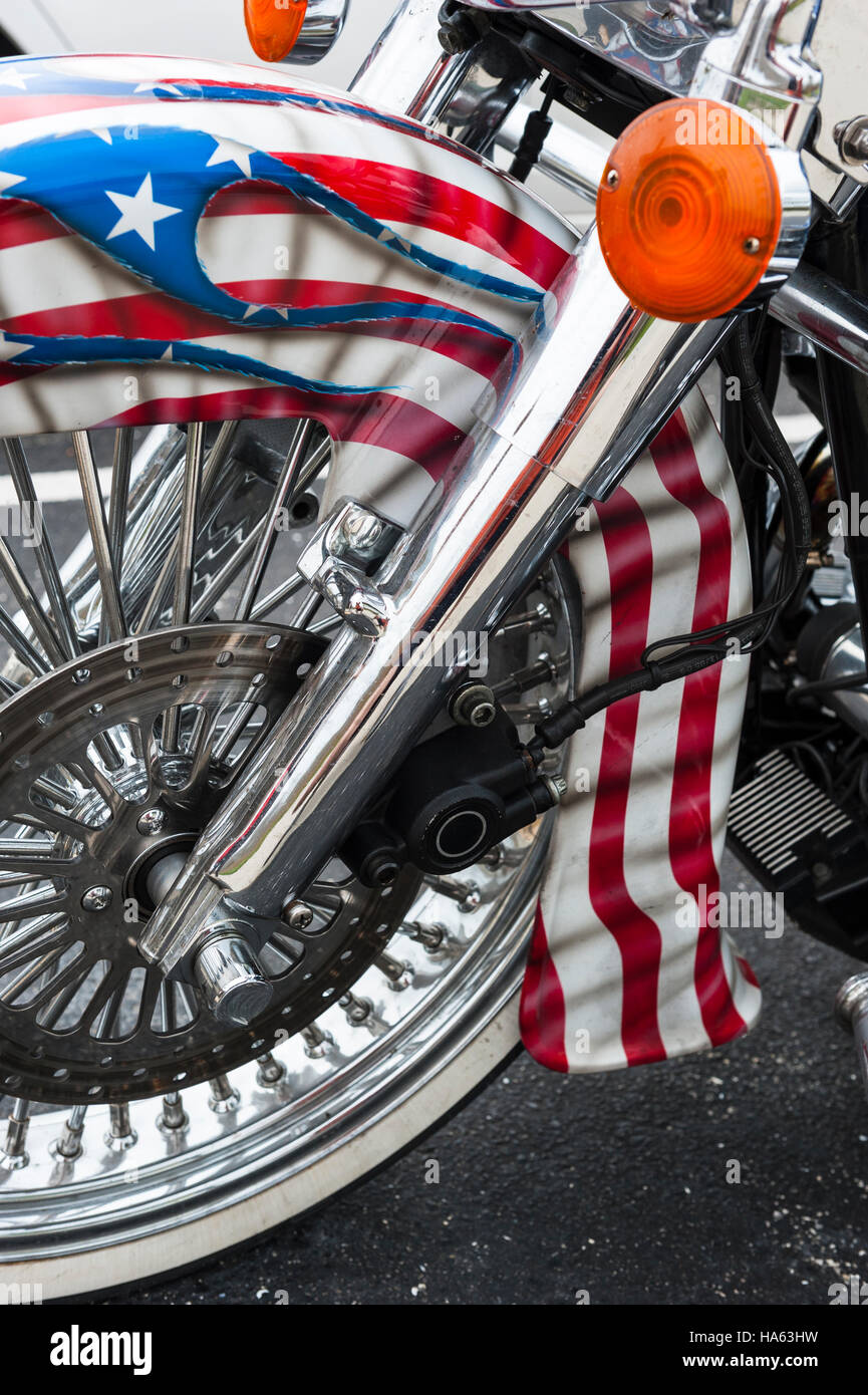 Detail of a custom motorcycle front wheel and fender painted with the colors of the American flag, United States of America, USA flag. Stock Photo